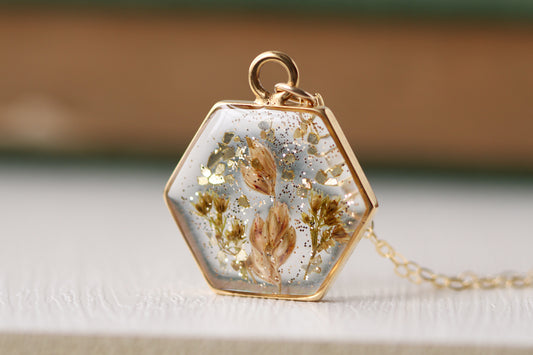 handmade flowers in resin gold necklace, hexagon necklace with dried botanicals and glitter