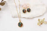 handmade dark green and gold small circle shaped dangle earrings with dried flowers and resin with matching necklace