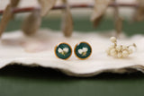 gold and dark green circle stud earrings with white dried alyssum flower handmade in clay with resin
