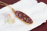 Burgundy and Gold Long Oval Pendant with Flowers
