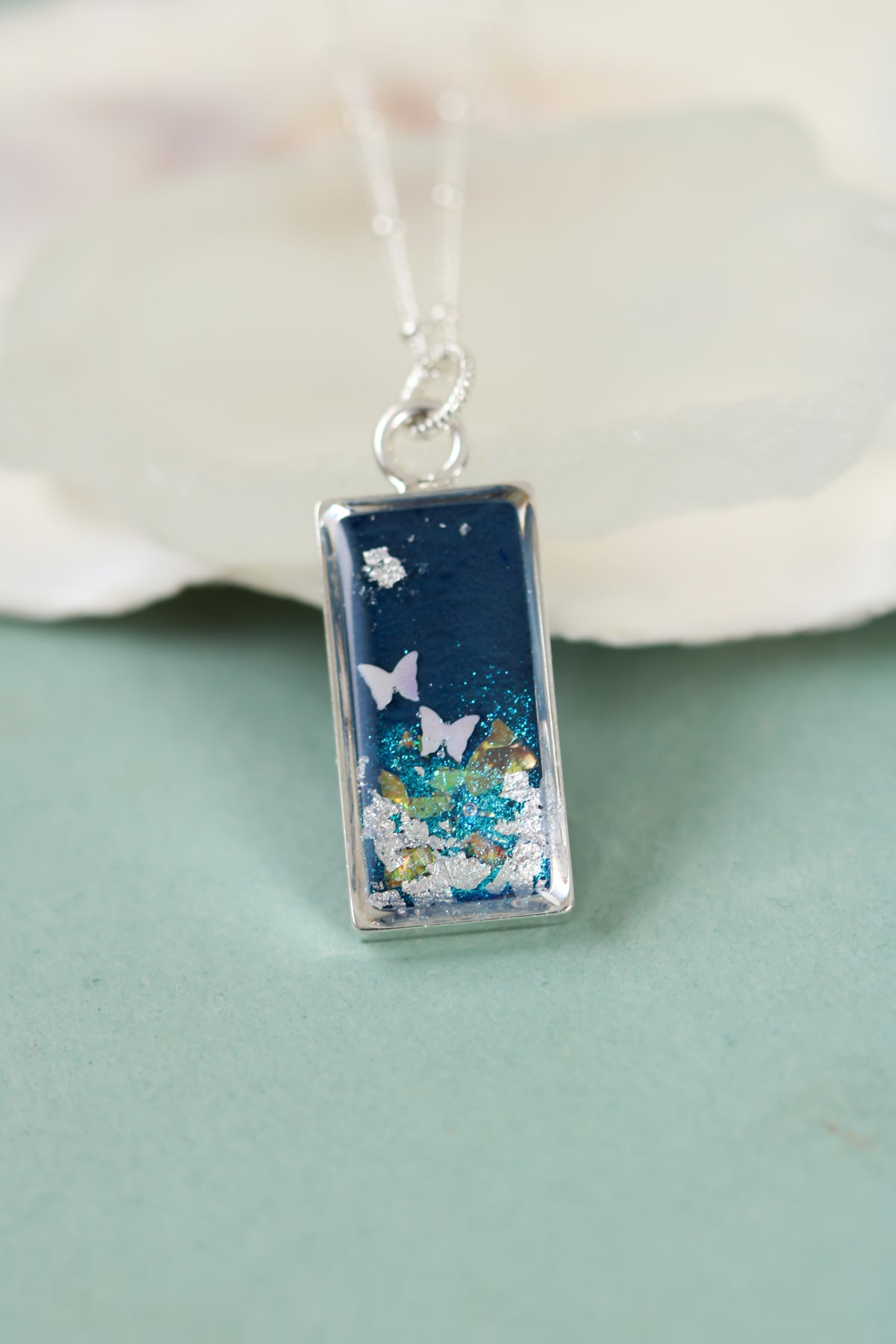 Blue Shimmer Pendant Necklace with Butterflies