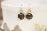 handmade dark green and gold small circle shaped dangle earrings with dried flowers and resin