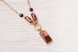 gold and burgundy dressy necklace with garnets