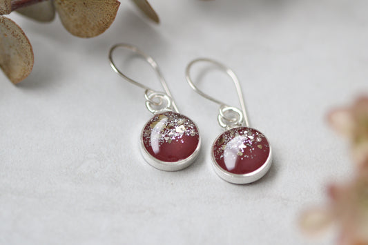 Silver small circle dangle earrings with burgundy background and glitter.  Resin earrings, handmade earrings
