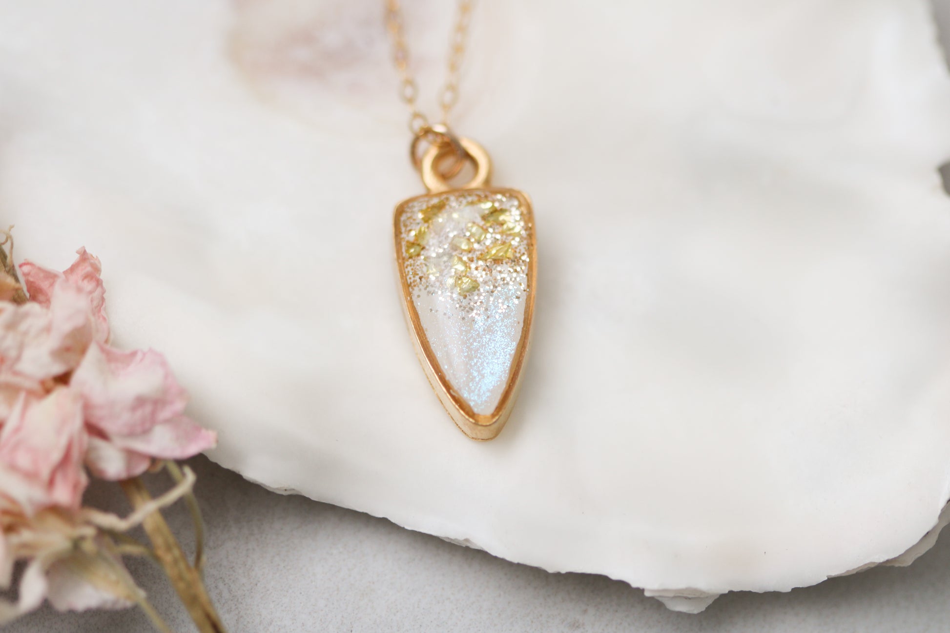 small gold sparkly pendant necklace on white background with flower, 18 inch gold filled chain