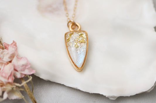 small gold sparkly pendant necklace on white background with flower, 18 inch gold filled chain