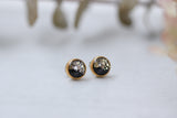 gold and black sparkly stud earrings made from epoxy clay, glitter and resin.  stainless steel posts.  handmade jewelry