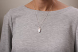 model wearing silver sparkly pendant necklace with sterling silver chain