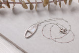 Silver oval shaped necklace with sparkle
