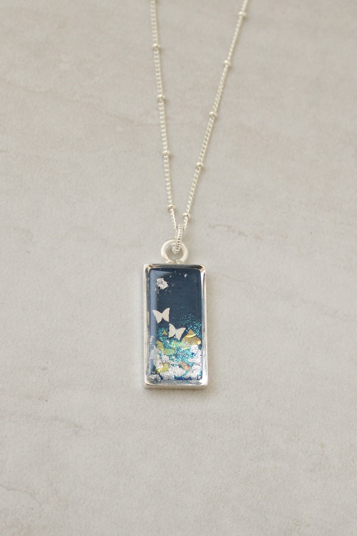 Blue Shimmer Pendant Necklace with Butterflies