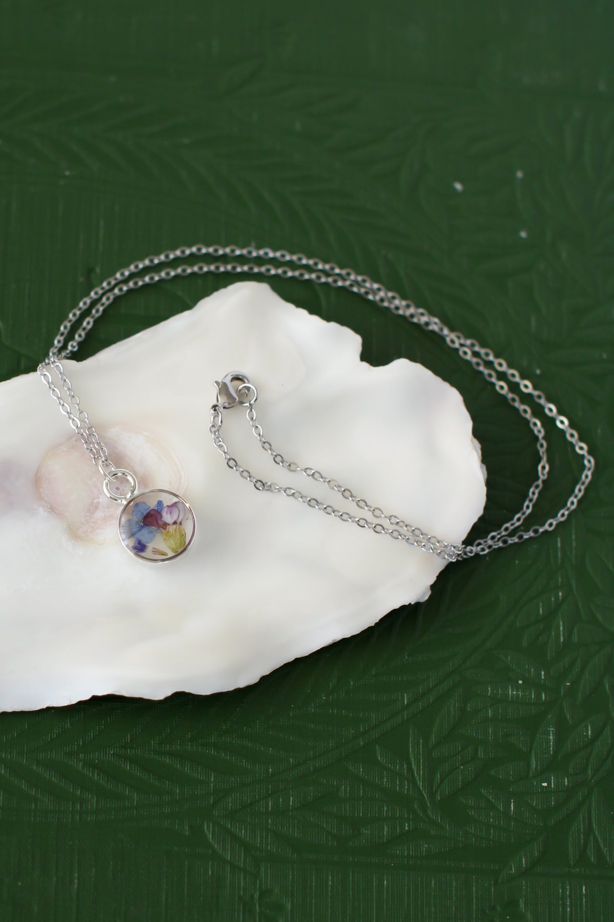Silver Mini Circle Necklace with Blue Flowers