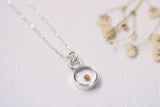 mustard seed necklace in silver circle clear resin