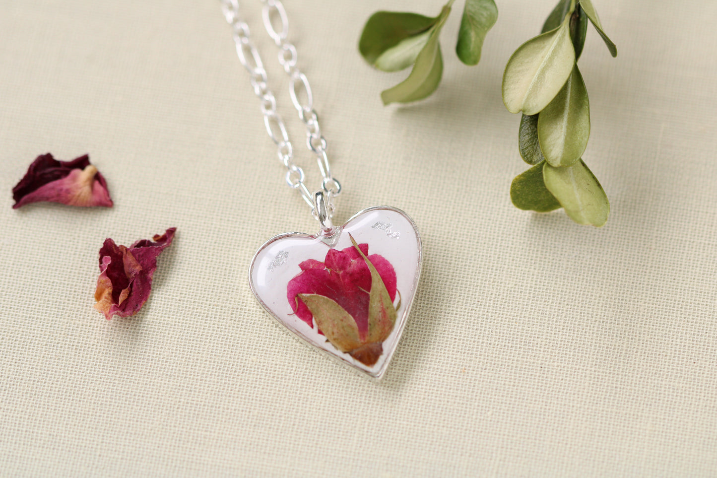 dried rose in silver heart necklace