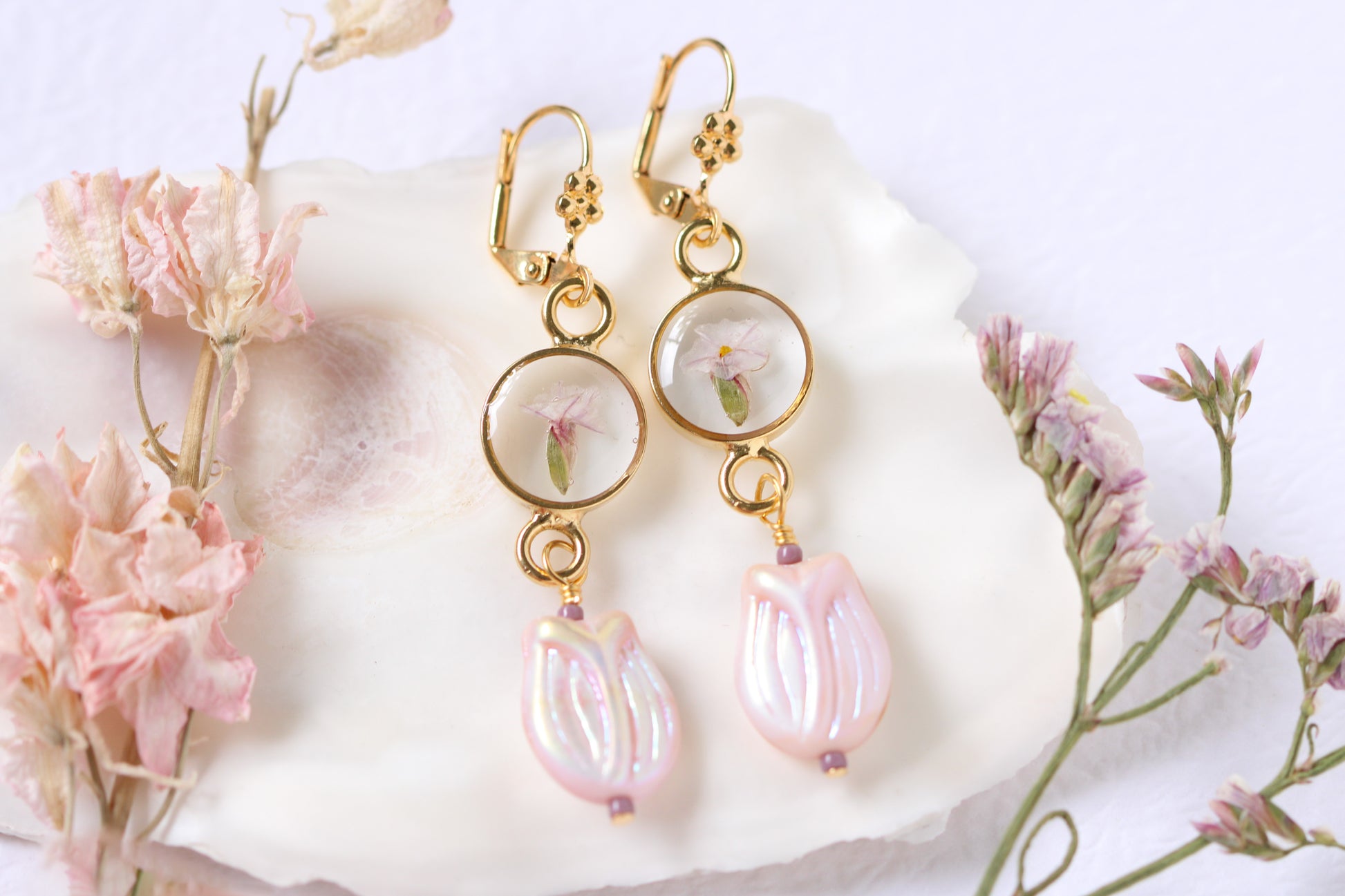 long dangle gold earrings with dried flower and purple tulip bead
