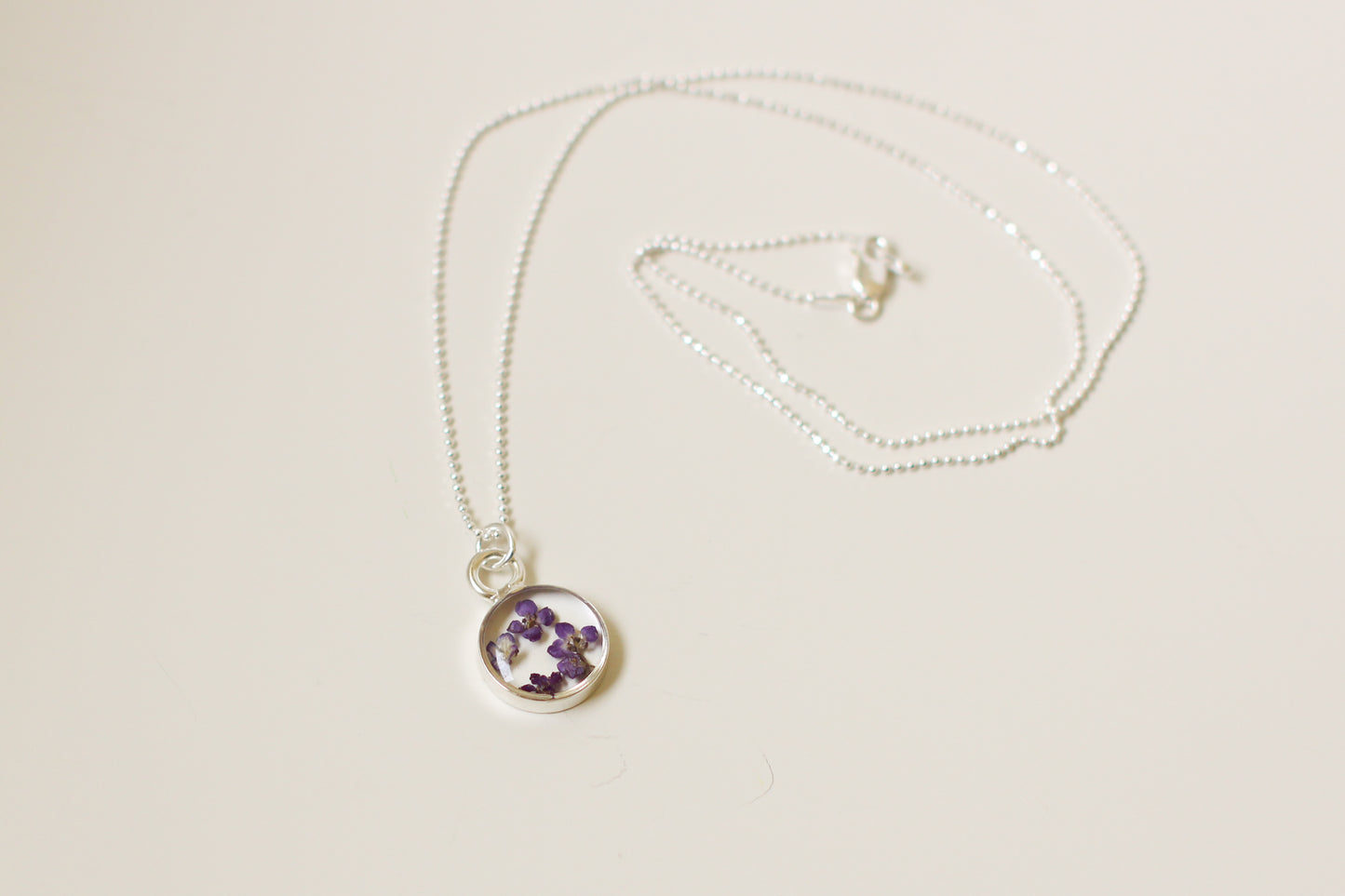 Silver Mini Circle Necklace with Purple Flowers