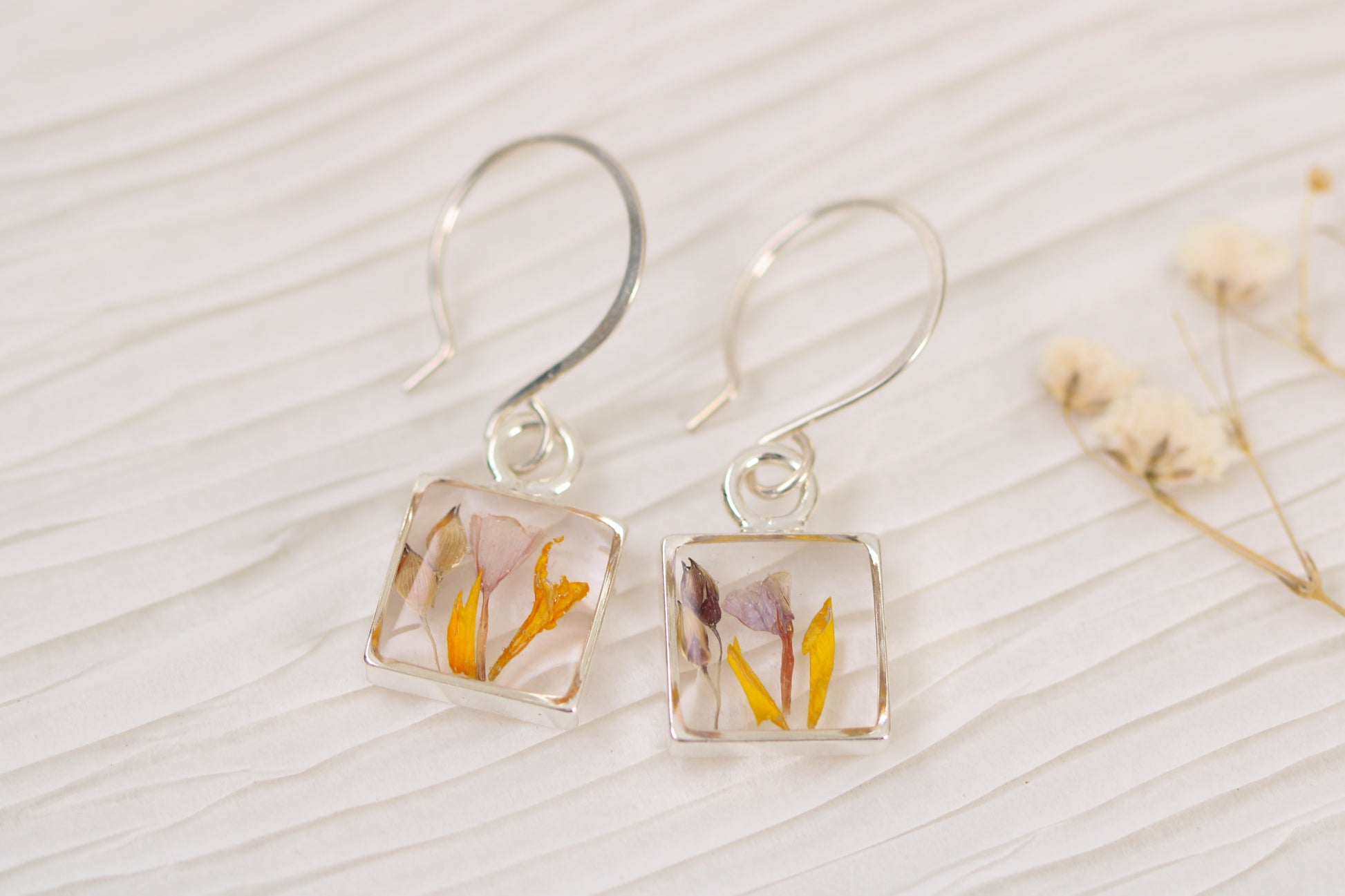handmade resin and flower earrings, silver square shaped dangle earrings with marigold, statice and sorghum