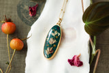 Dark Green Long Oval Necklace in Gold with Dried Flowers