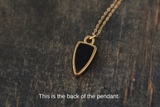 Gold and Black Arrowhead Seed Pod Necklace